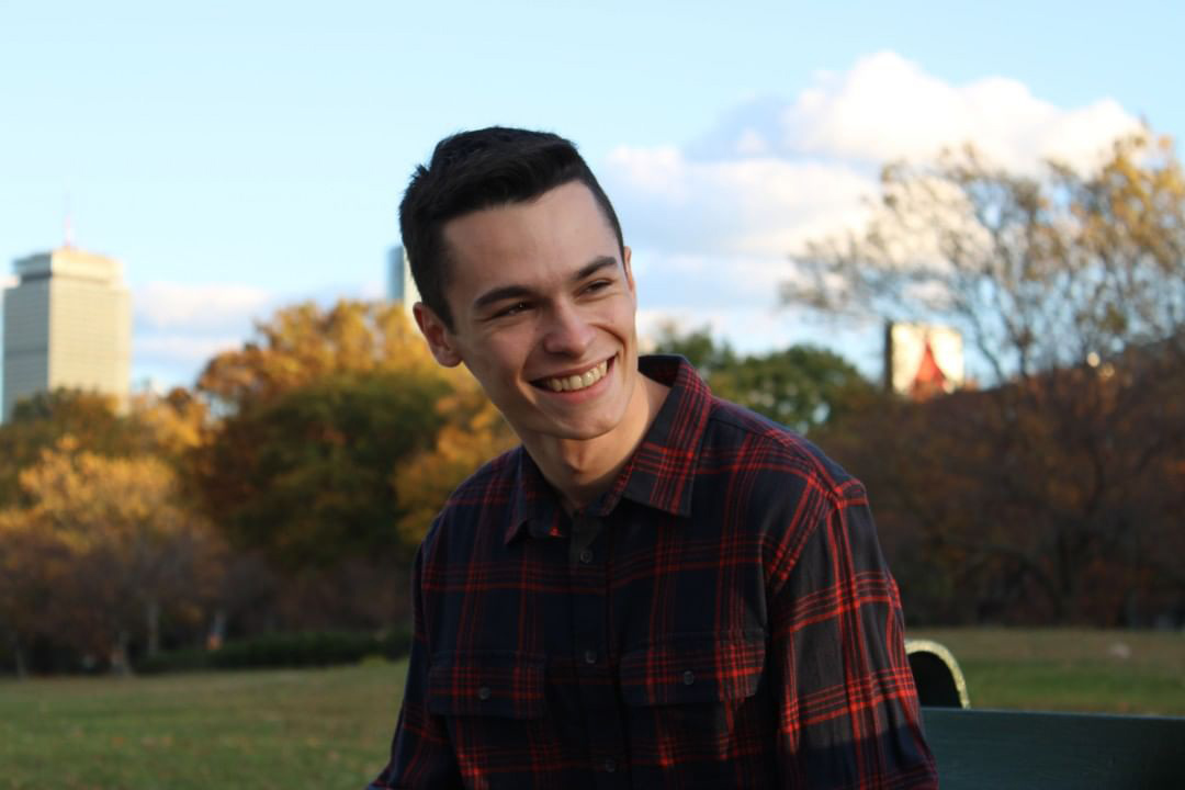 kyle hammanian sitting on a bench in boston