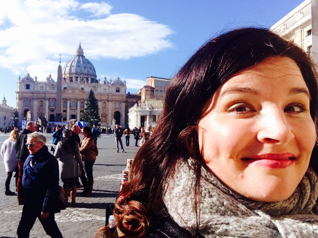 Selfie taken by BU alum and scholar Jenn Lindsay, with the Vatican City behind her. Her documentary explores Vatican religious observance during the pandemic, as well as practices of Rome’s other faith traditions.