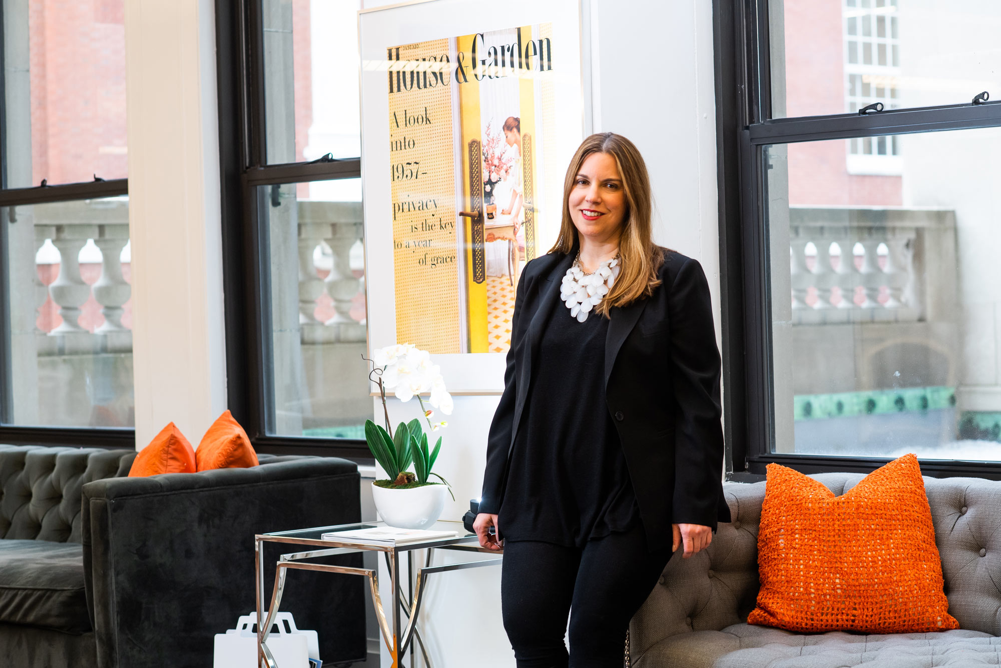 A portrait photo of Marlo Fogelman standing in a conference room