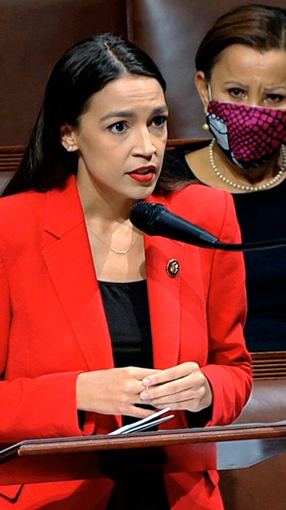 A photo of Rep. Alexandria Ocasio Cortez speaking on the House floor
