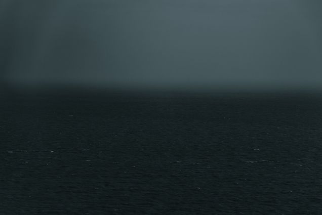 Photo of a body of water during what looks like an evening storm.