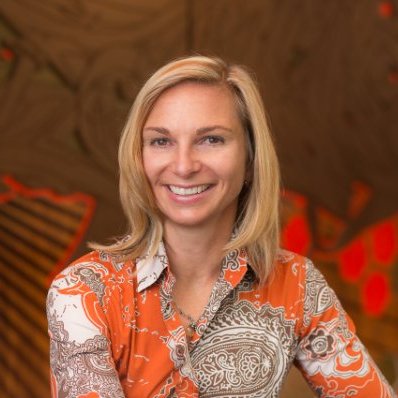 Headshot of Rebecca Norlander (CAS’91) wearing a bright orange floral blouse.