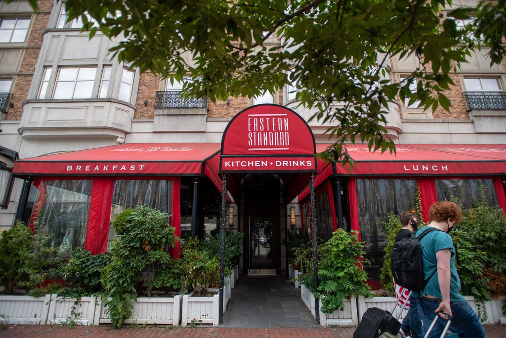 A photo of the red awning of Eastern Standard, a restaurant in Kenmore, during the Summer of 2020. 