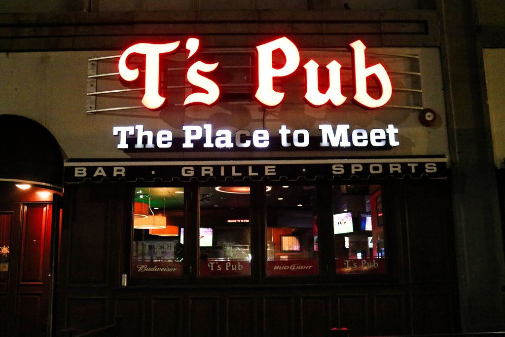 Photo of the facade of popular student haunt T’s Pub announced it would close before the pandemic hit. The neon sign reads "T's Pub, the place to meet."