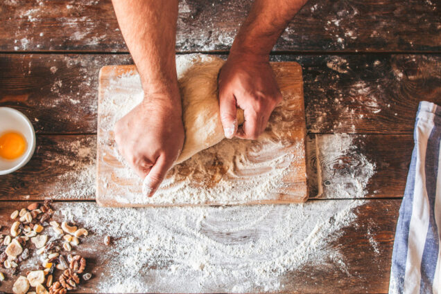 A photo of someone working with dough