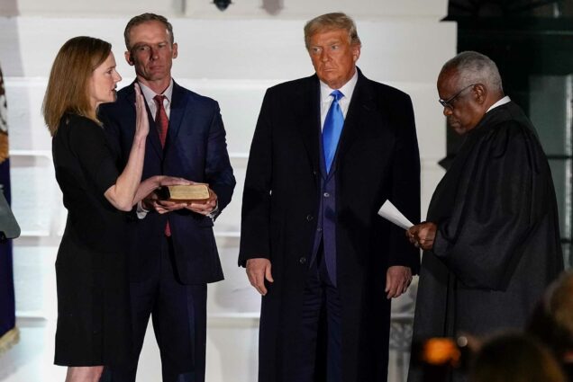 Amy Coney Barrett is sworn in as a justice of the Supreme Court of the United States by Clarence Thomas