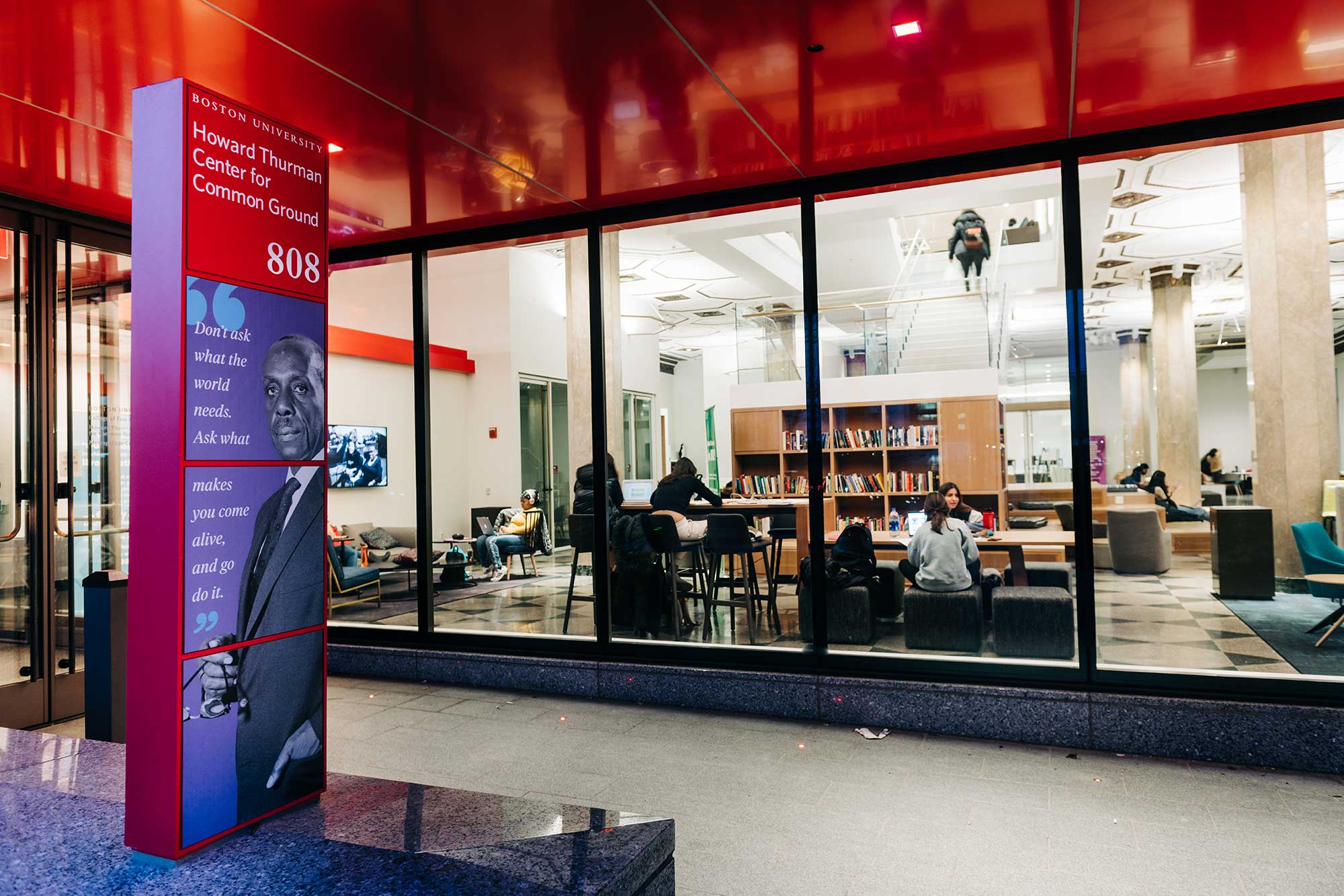 View of the Boston University Howard Thurman Center for Common Ground through the windows at night
