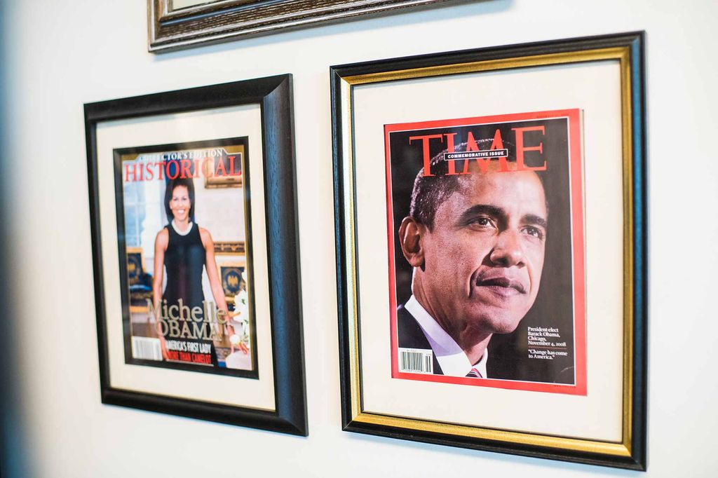 Magazine covers featuring Michelle Obama and Barack Obama hang on the wall in Katherine Kennedy's office at the Boston University Howard Thurman Center for Common Ground