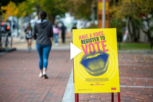 A sign posted on Commonwealth Ave says "Have a voice, register to vote" Overlay has a white video button overlay.