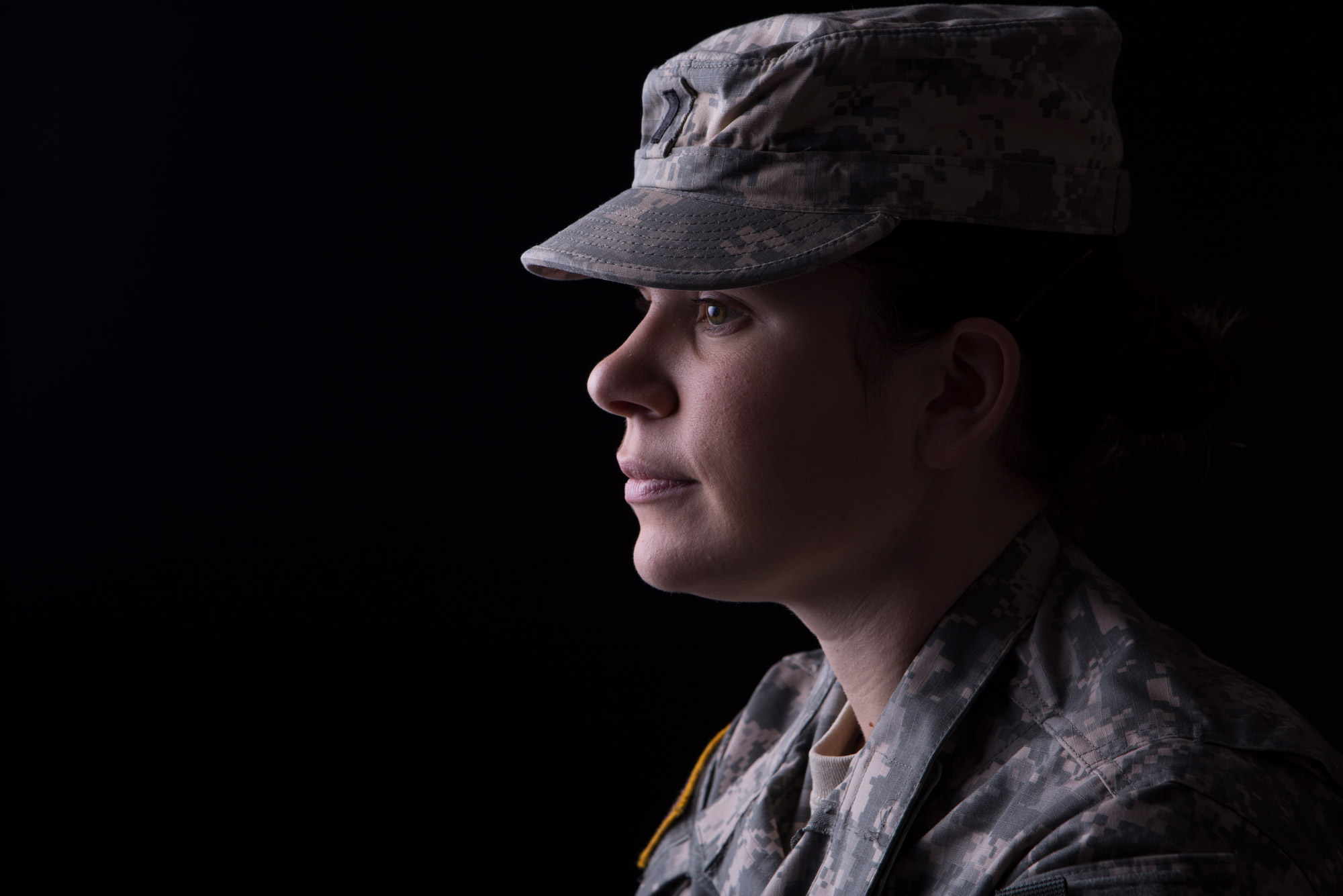 A photo of a solider in front of a black background