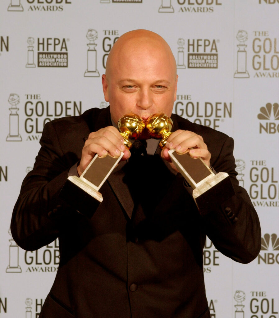 Michael Chiklis (’85) on stage receiving Golden Globes for for his role on The Shield in 2003.