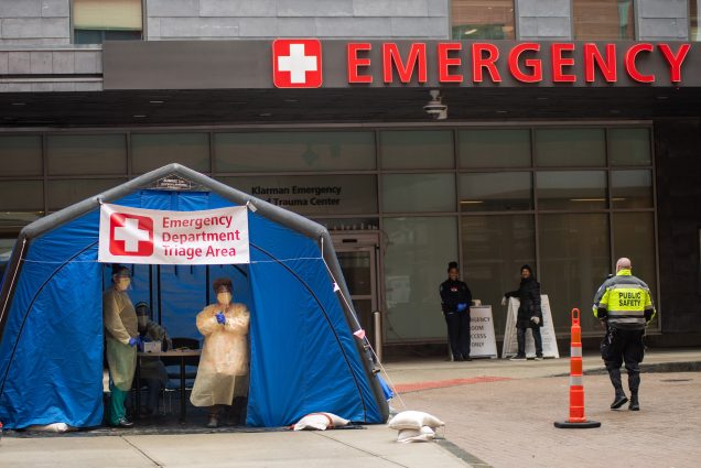 A photo of a tent set up outside of the Boston Medical Center emergency room