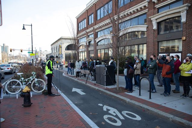 A gathering of family, friends, city officials, bicycle advocates, and others from the BU community filled the sidewalk on Saturday, November 21, 2020, to celebrate the life of Christopher Weigl with a memorial ghost bike installation ceremony on the corner of Commonwealth Avenue and St. Paul Street in Boston, where he was killed on his bike by a truck driver in December of 2012.