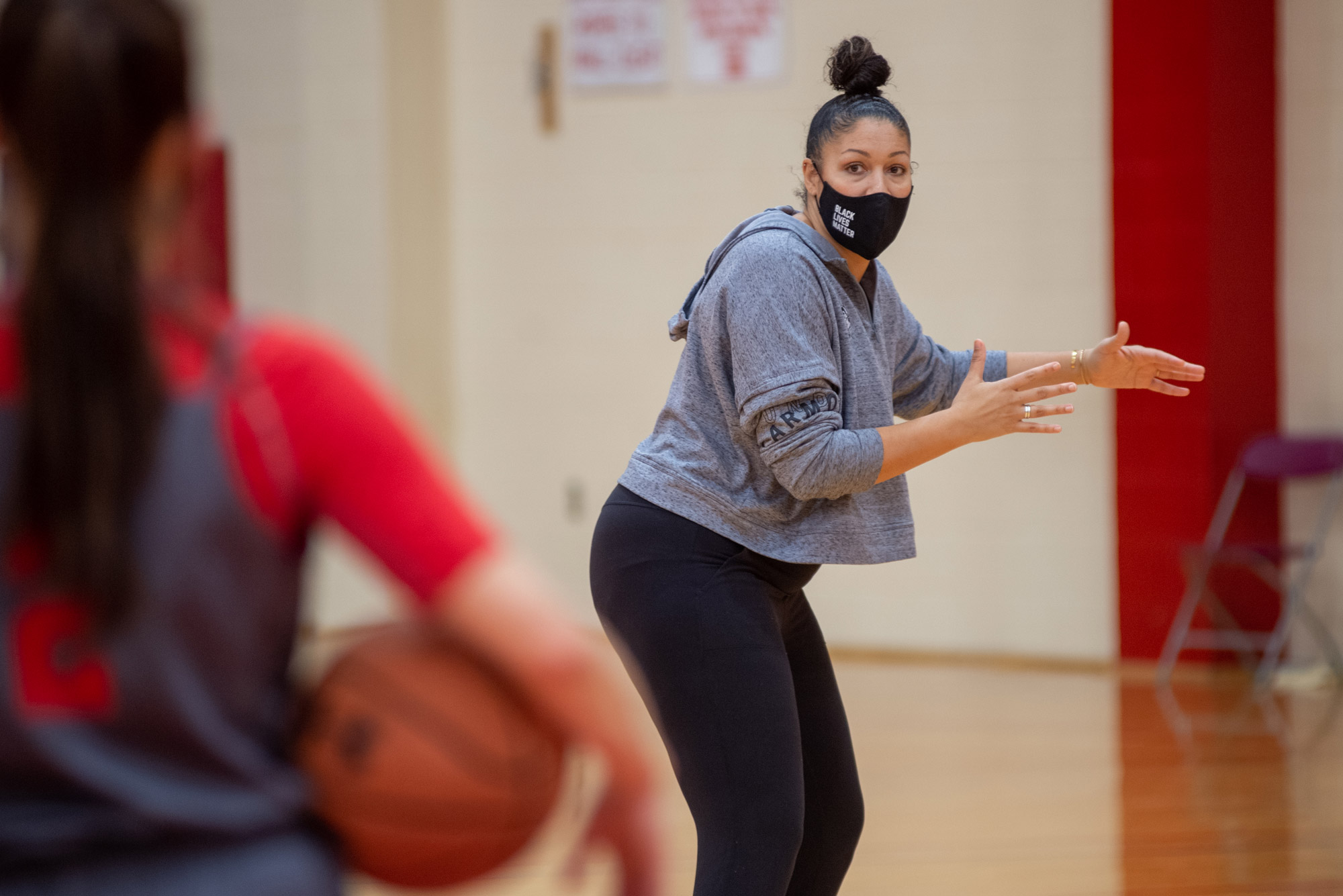 The BU Women’s basketball head coach Marisa Moseley advises her players as they practice in pods on December 9 in Case Gym.