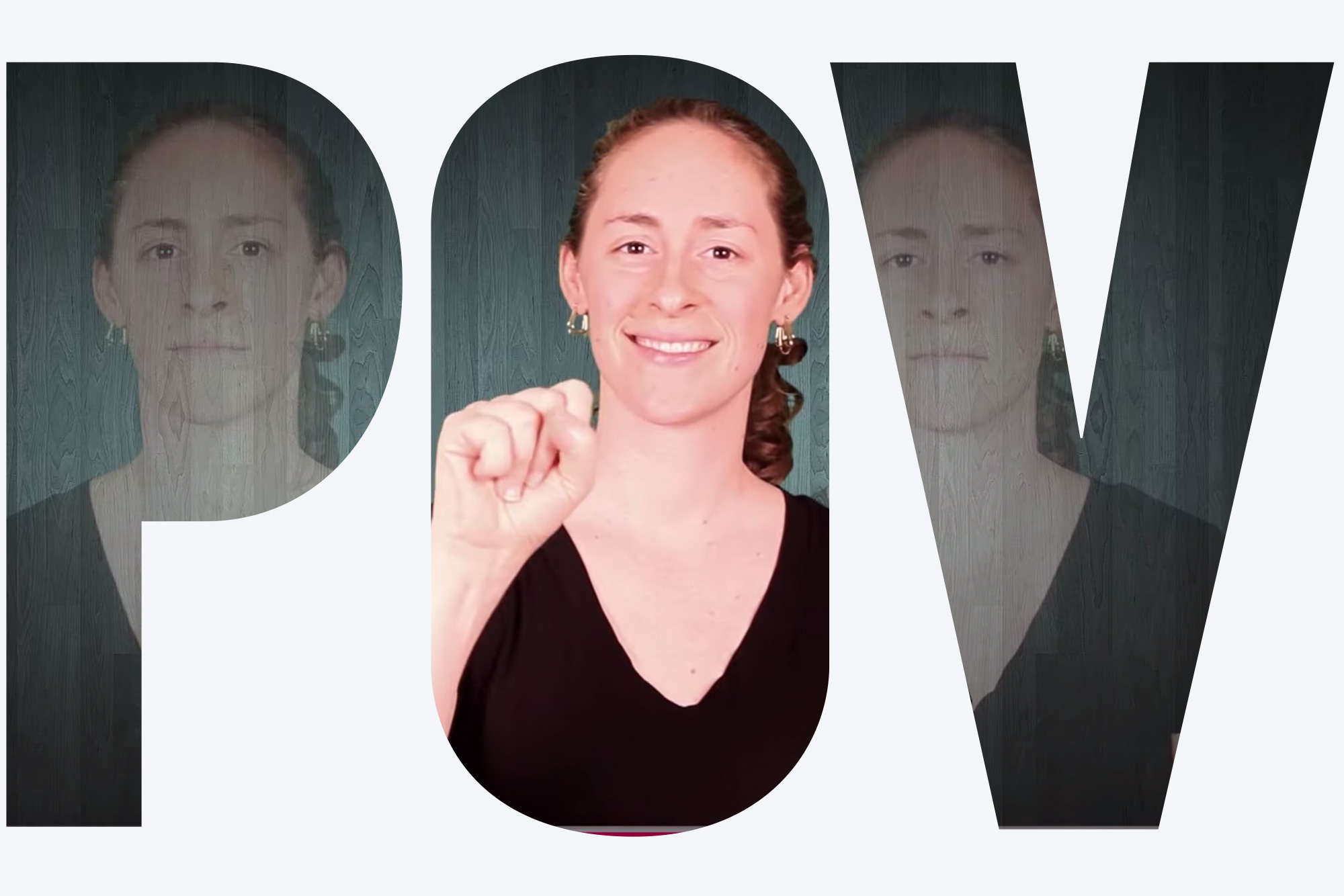 Photo of Elsie Stecker signing in ASL during a video on the word 'commotion.' Elsie wears a black v-neck and smiles as she seems to make the sign for the letter 'M'. Overlay reads "POV"