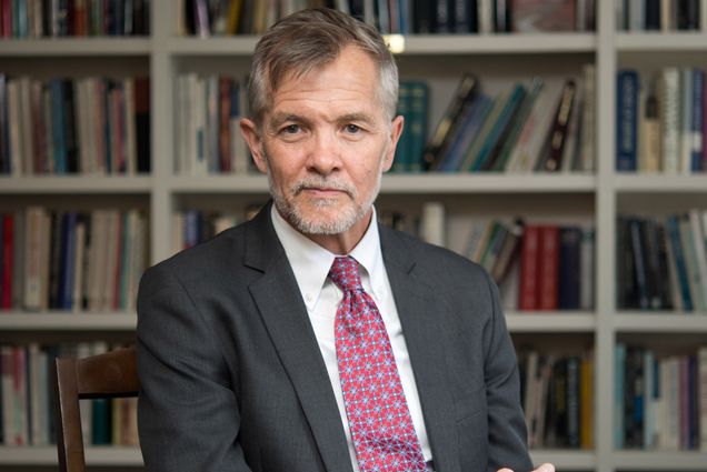 A portrait photo of David Chard sitting in his office