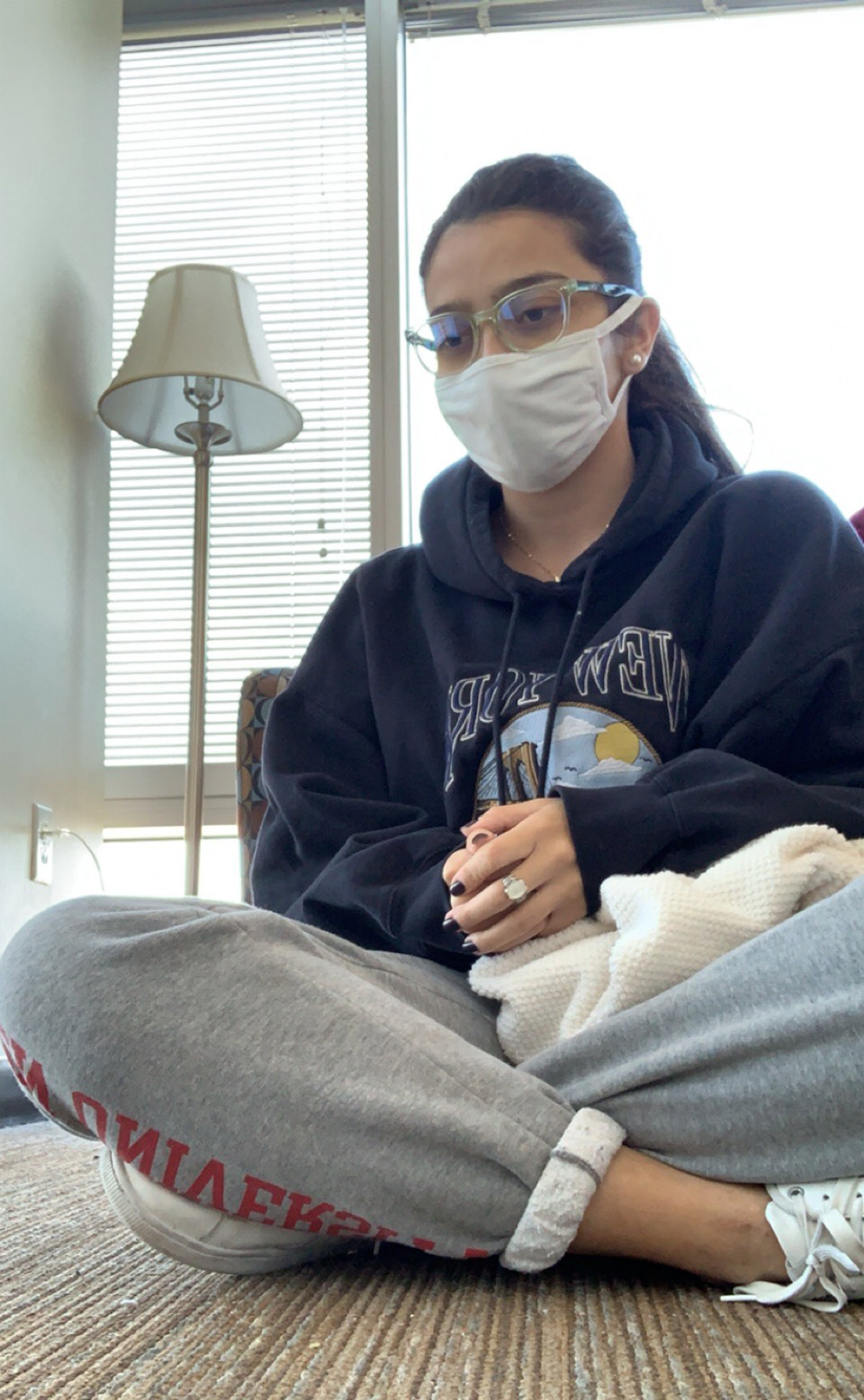 A photo of Manuela Luque wearing a mask in quarantine
