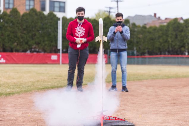A photo of Adam Boldi (ENG'23), left, and Lorenzo Moriche (ENG'24) launching a rocket for EK131 (Introduction to Rocket Science) on Sunday April 11