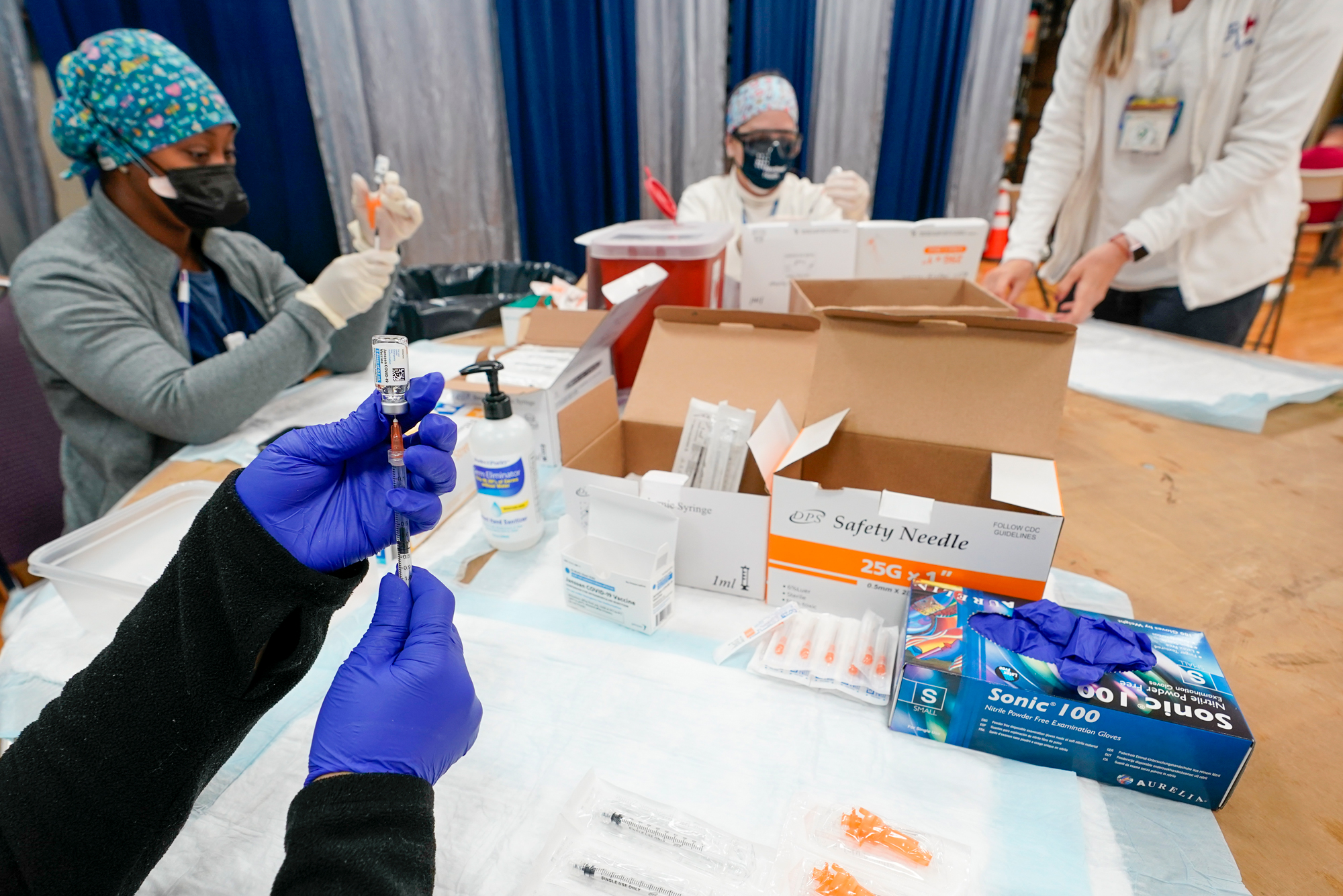 Northwell Health registered nurses fill syringes with the Johnson & Johnson COVID-19 vaccine at a pop up vaccinations site the Albanian Islamic Cultural Center, Thursday, April 8, 2021, in the Staten Island borough of New York.