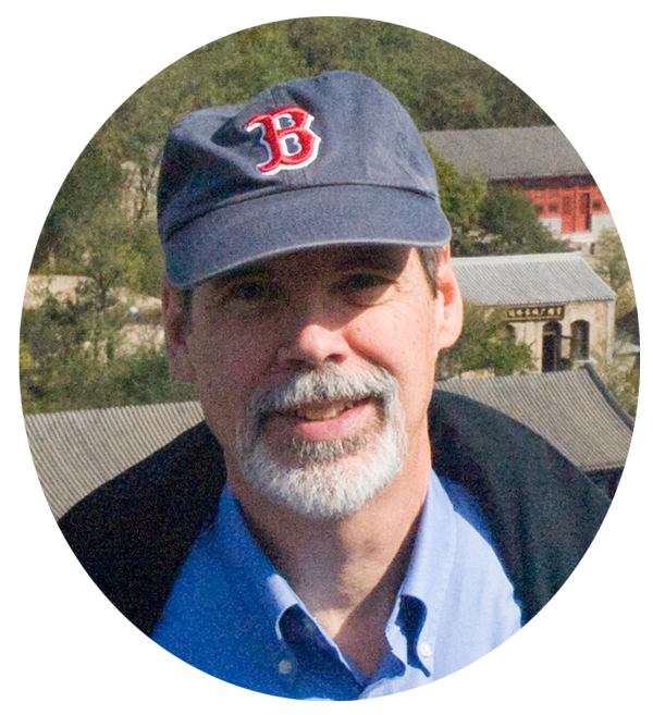 A headshot of Lee Roberts. In the photo he is a wearing a Red Sox hat.