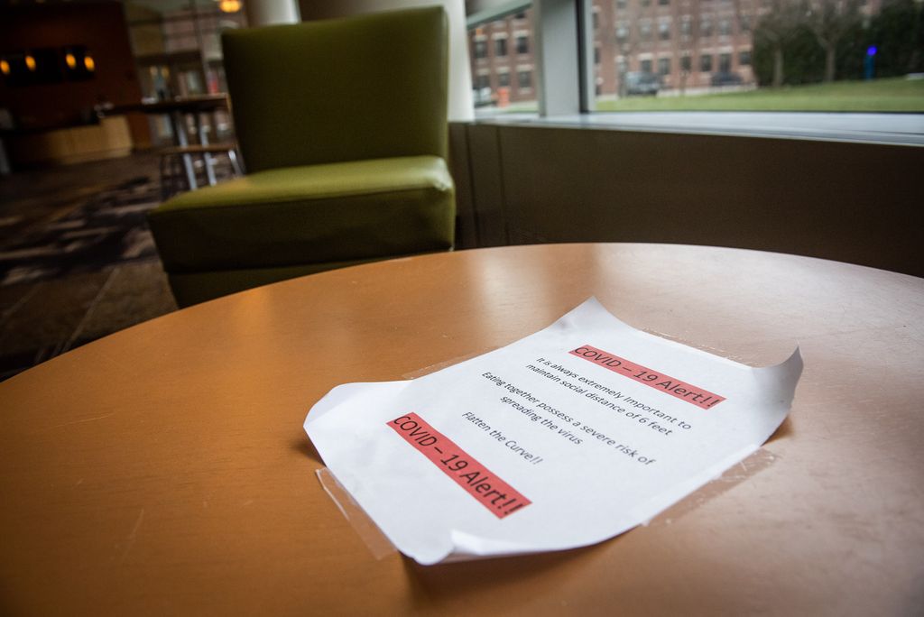 A flyer left on a table of the Fenway Campus on proper social distancing guidelines