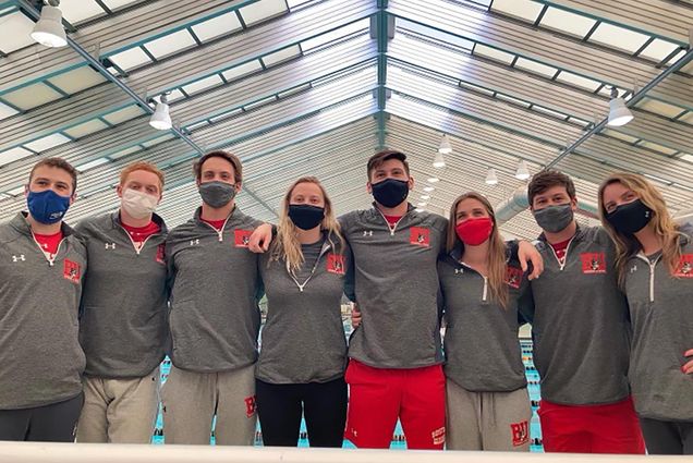 Photo of the men and women's swimming and diving team after the Patriot League Challenge. They stand with their hands on each other's shoulders and wear gray and red BU athletics gear. From left to right, the students are as follows: Stephen Johnson (ENG’21), Erik Ryan (Questrom ’21), Alex Yokubison (ENG’21), Megan Wimmer (ENG’21), Daniel Bradford (ENG’21), Sydney Lee (CAS’21), David Rak (ENG’21), and Kara Lydzinski (Sargent’21).