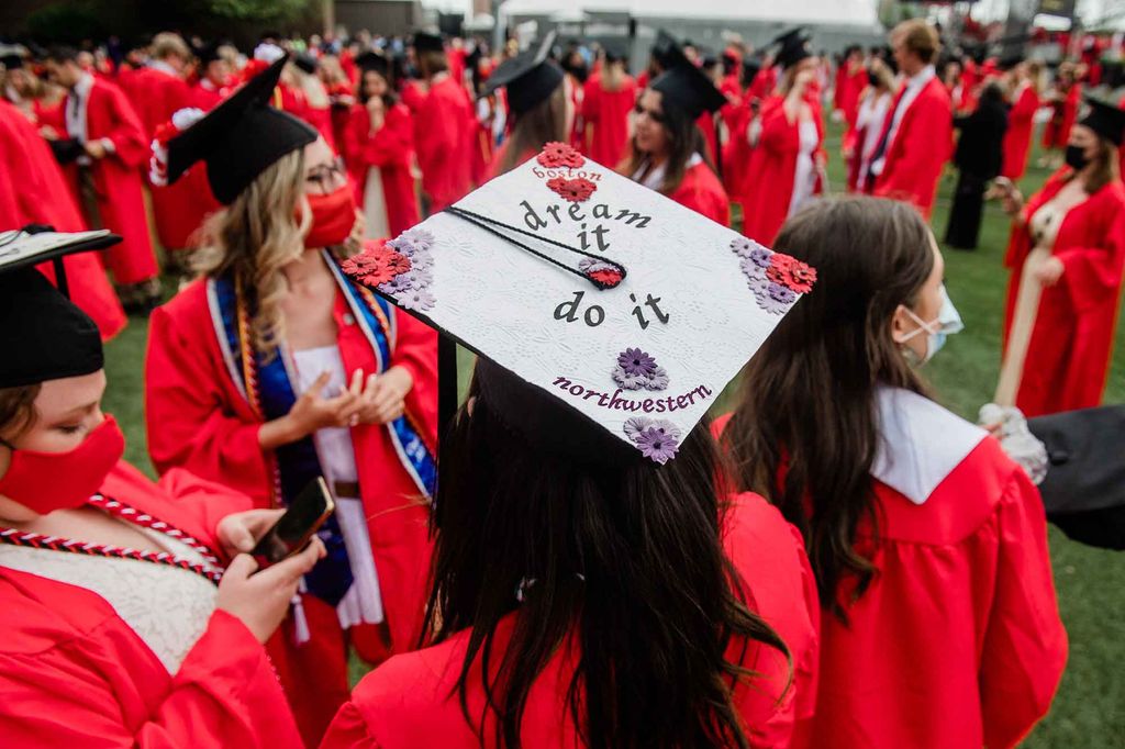 View of a decorated mortarboard that reads 'Dream it, Do it. Boston, Northwestern'