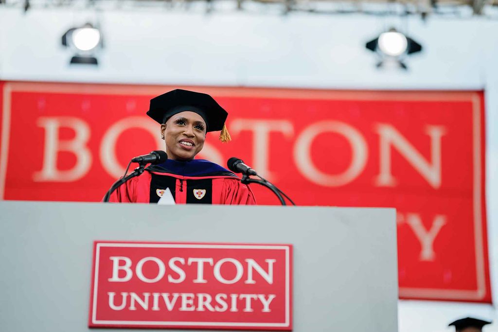 US Representative Ayanna Pressley addresses graduating seniors from the podium on Nickerson Field during the 2021 BU Commencment for undergraduate degree students.