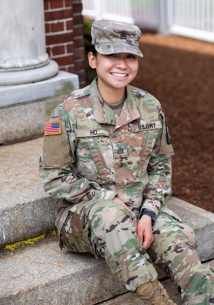 A photo of Victoria Ho sitting down on a set of stairs