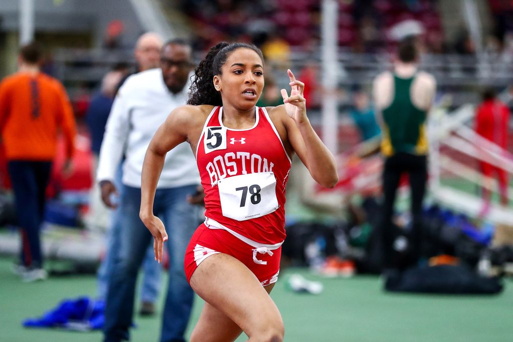 A photo of Mikajah Hayes running on the track