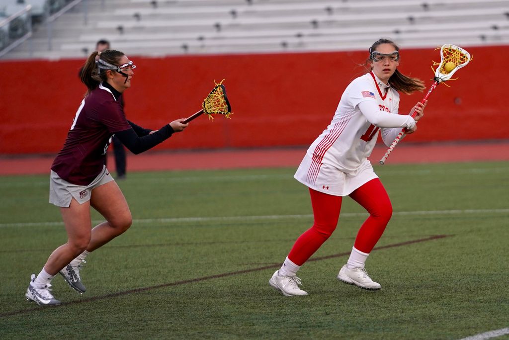 A photo of Megan Hickey on the field playing lacrosse