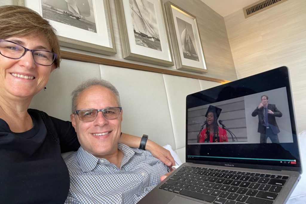 A photo of Claire and Gary Gelfman watching the commencement ceremony from their hotel room 