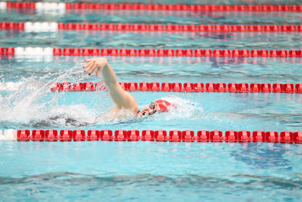 A photo of Sydney Lee swimming in the pool