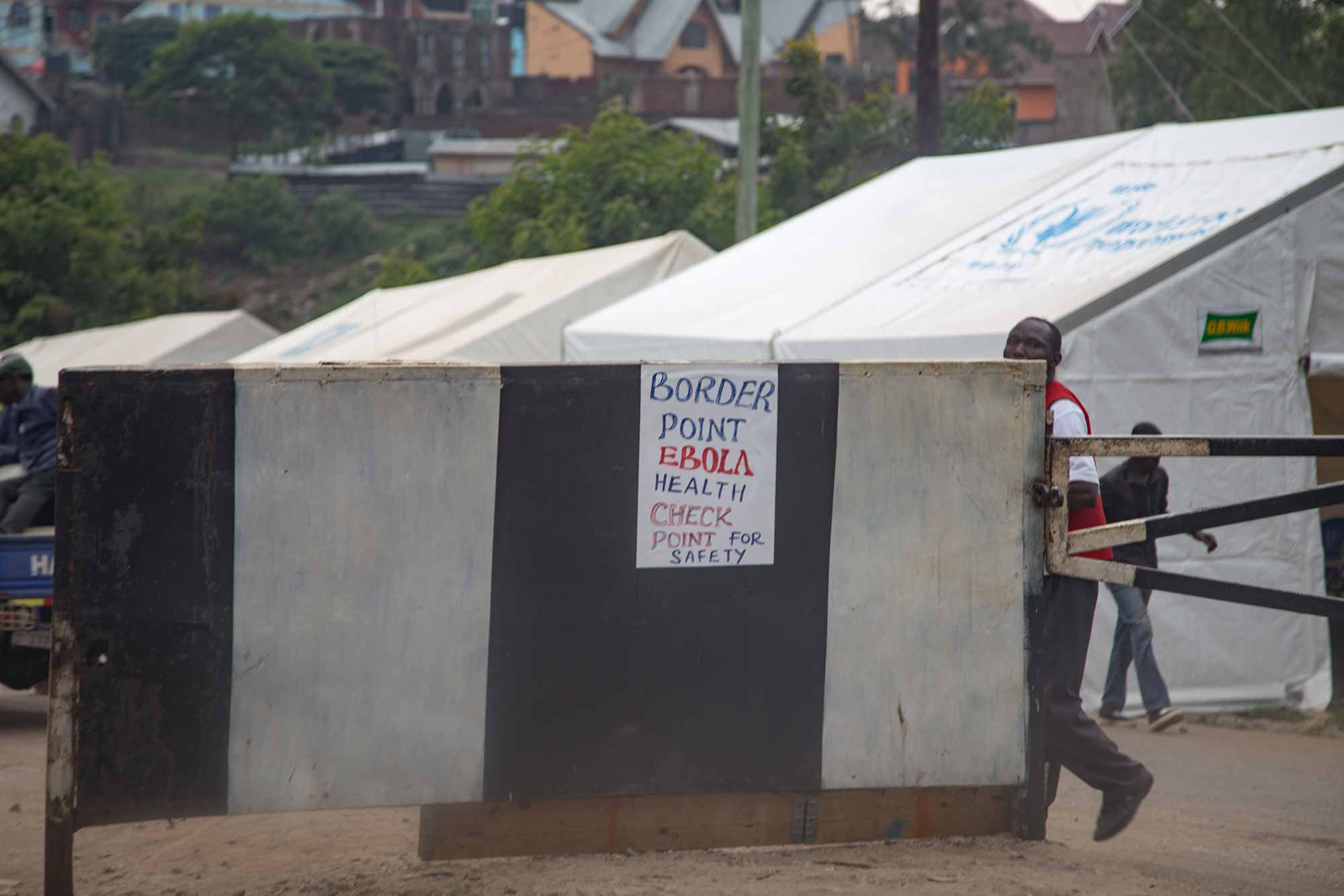 Sign on a gate in West Africa designates an Ebola check-point.