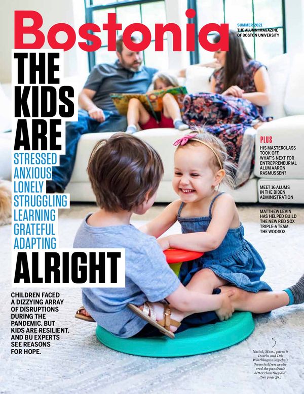 Cover of the Summer 2021 edition of Bostonia. The cover features a photo of the Worthington family in their home in Natick, Mass. In the foreground, two children play on a spinning toy. In the background, an older child reads with the parents. The cover reads “Bostonia. The kids are….stressed, anxious, lonely, struggling, learning, grateful, adapting…ALRIGHT: Children faced a dizzying array of disruptions during the pandemic. But kids are resilient, and BU experts see reasons for hope.” At right, the cover reads in smaller text “His MasterClass Took Off. What’s Next for Entrepreneurial Alum Aaron Rasmussen? Meet 16 Alums in the Biden Administration Matthew Levin Has Helped Build the New Red Sox Triple-A Team, the WooSox” and a caption pointing to the children that reads “Natick, Mass., parents Dustin and Deb Worthington say their three children weathered the pandemic better than they did. (See page 38.)”