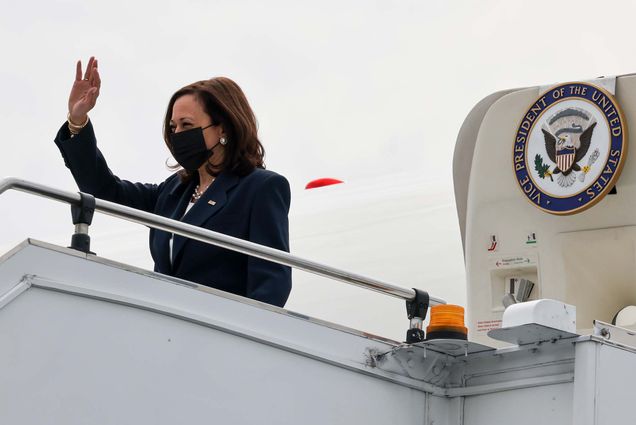 Vice President of the United States Kamala Harris waves as she deboards Air Force Two in Singapore at the start of her trip to Southeast Asia.
