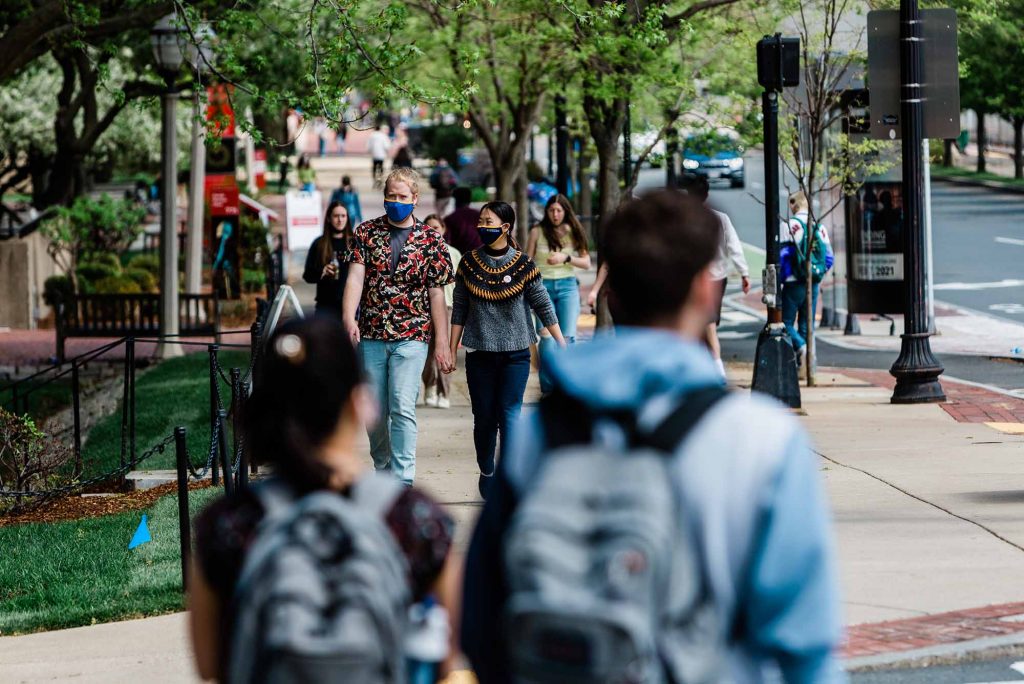 Students walk along Commonwealth Ave on Boston University's Charles River Campus.