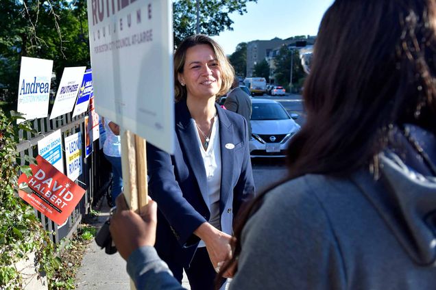 Mayoral Candidate City Councilor Annissa Essaibi George greets campaigners outside a polling place in the Roxbury neighborhood of Boston on Tuesday, Sept. 14, 2021.