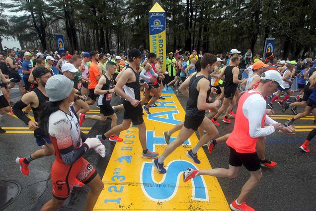 Runners cross the start line of the 123rd Boston Marathon on Monday, April 15, 2019, in Hopkinton, Mass.