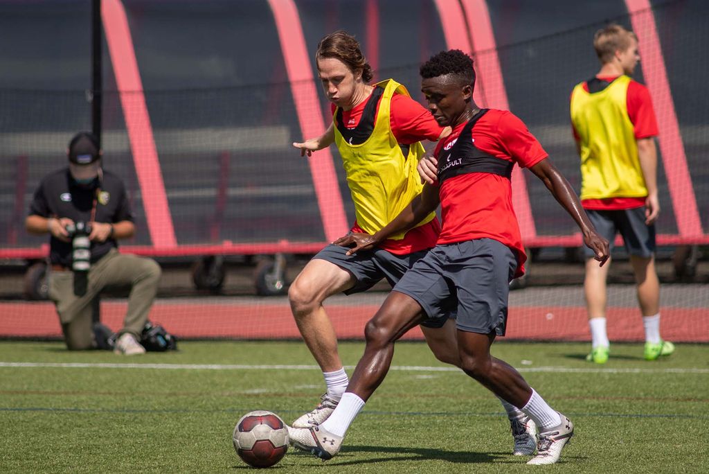 Boston University soccer players, Colin Innes and Peter Kargbo, compete during a pre-season training session on Nickerson Field.