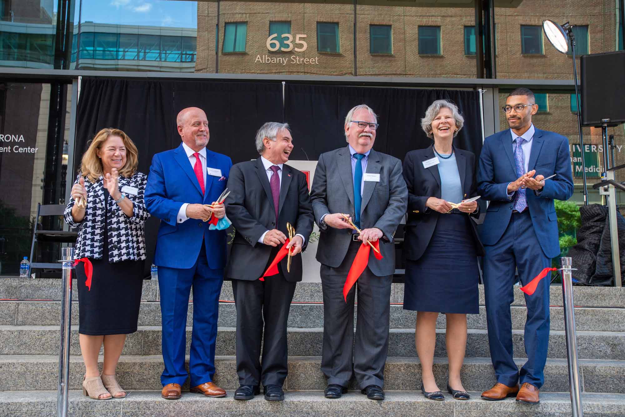 Dr. Terri Dolan, David Lustbader, Cataldo Leone, Robert A. Brown, Karen Antman, and Justin Middleton at the ribbon cutting celebrating the completion of the three-year, $115 million expansion and renovation of the Goldman School of Dental Medicine, Tuesday, September 21.