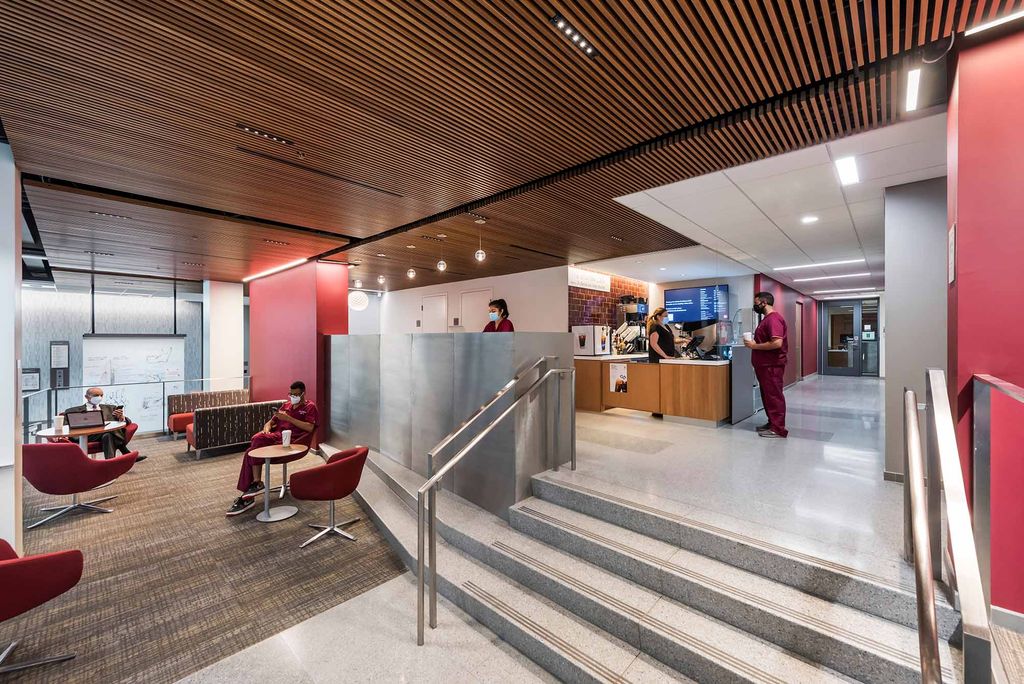 Students make a purchase at the snack bar in one of the new collaborative spaces at the Boston University Goldman School of Dental Medicine.