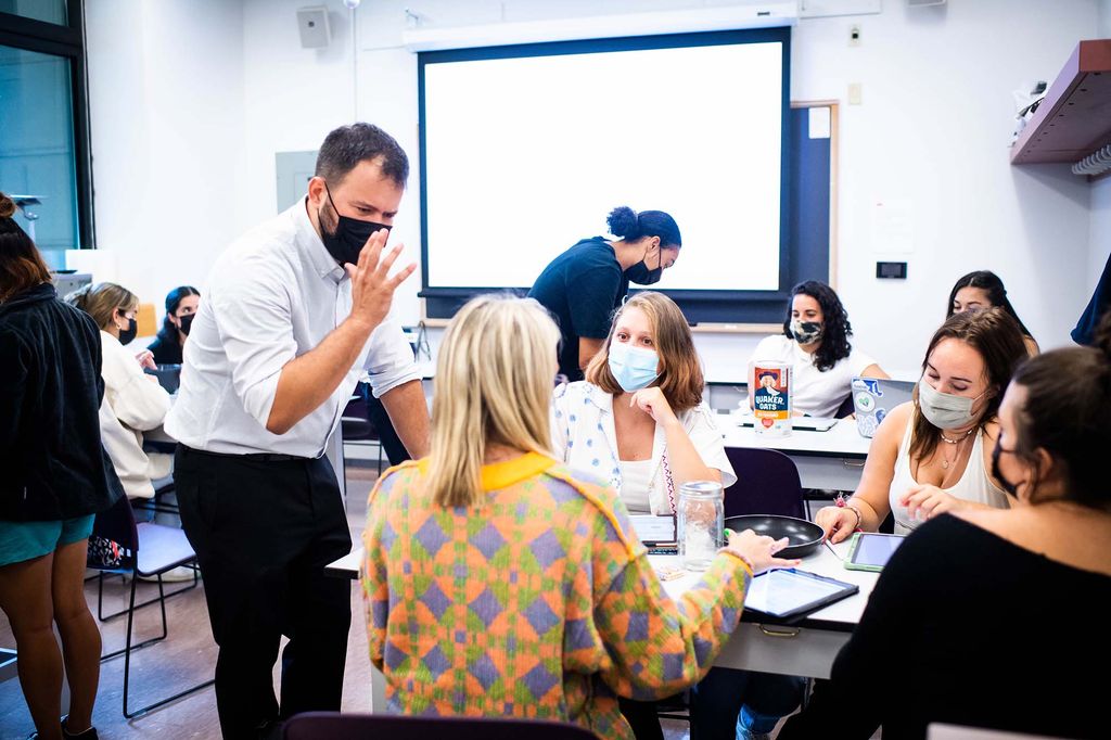 Professor Pedro Almeida works with students in a graduate Skills course at Sargent College on the first day of classes, September 2, 2021.