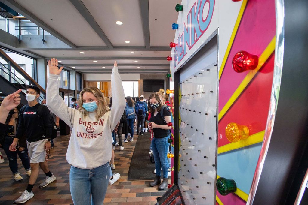 A Boston University students celebrates winning the game Plinko during the First Day Festival at the George Sherman Union. She won a BU tee-shirt.