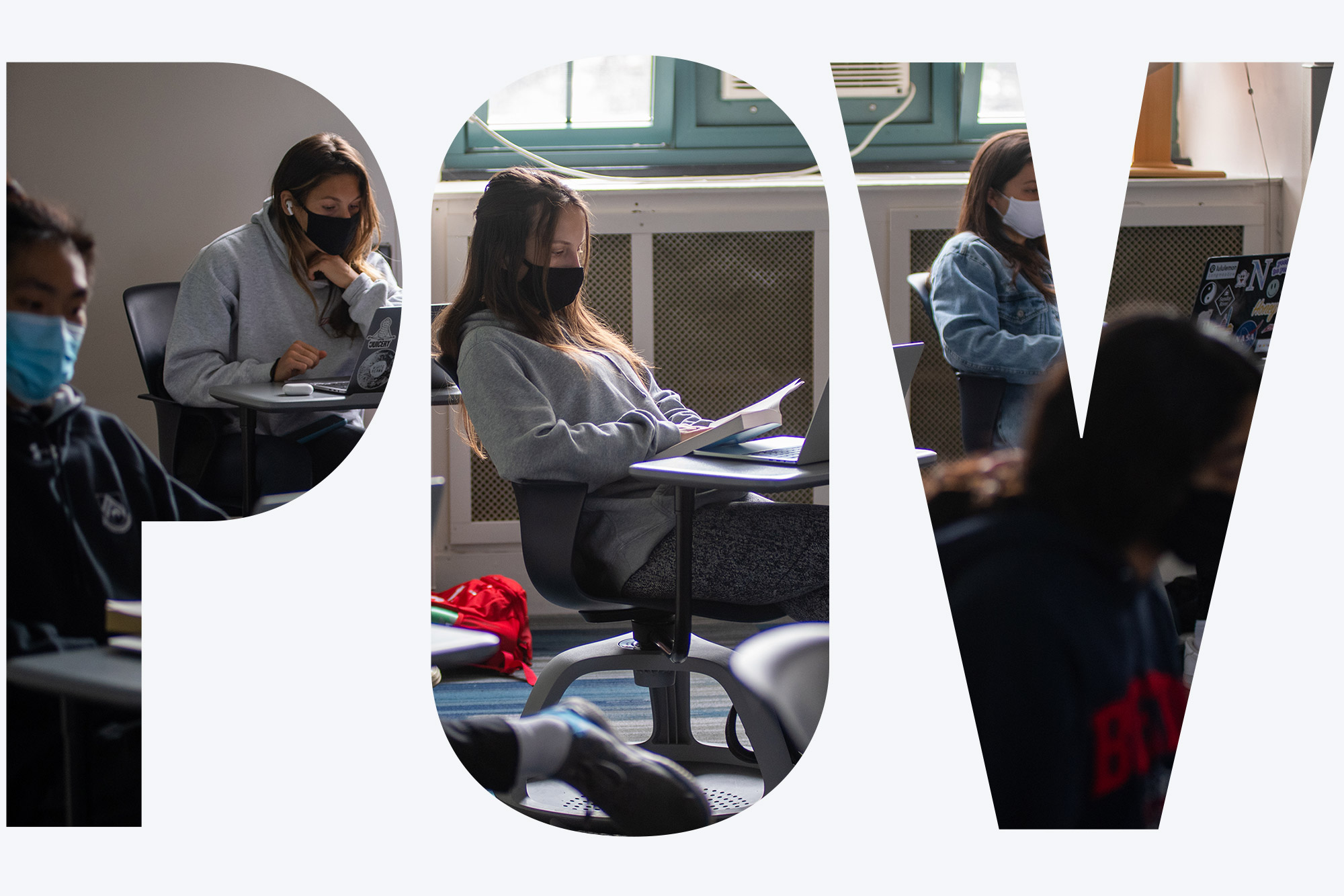 Photo of Emily Chua’s class WR120 K8 Planet Ocean, a first-year writing seminar focused on ocean science in CAS September 22, 2020. Students sit in rolling desks and look at their laptops; many of them wear sweatshirts and all of them wear facemasks in the dimly lit classroom. Overlay reads "POV"