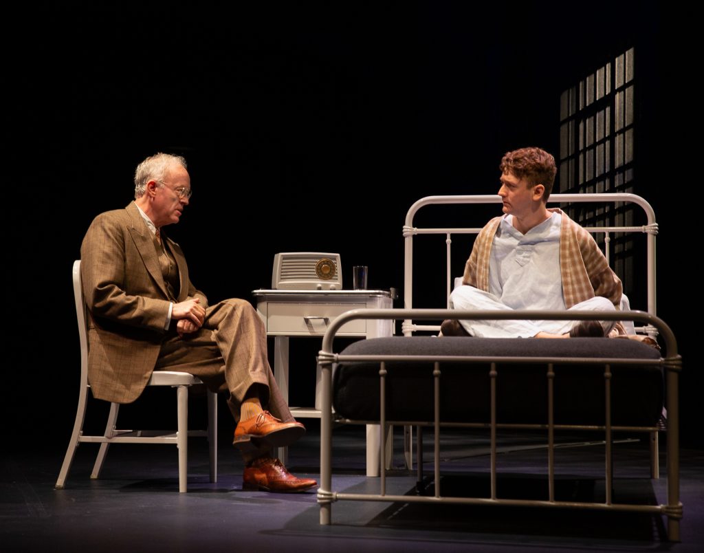 Reed Birney (left) sits next to his bedridden son, Ephraim Birney, as they act together in Barrington Stage Company’s production of Joseph Dougherty’s Chester Bailey