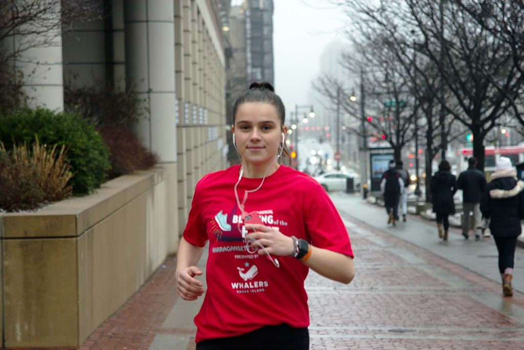 Caroline Adamson running down Commonwealth Ave.