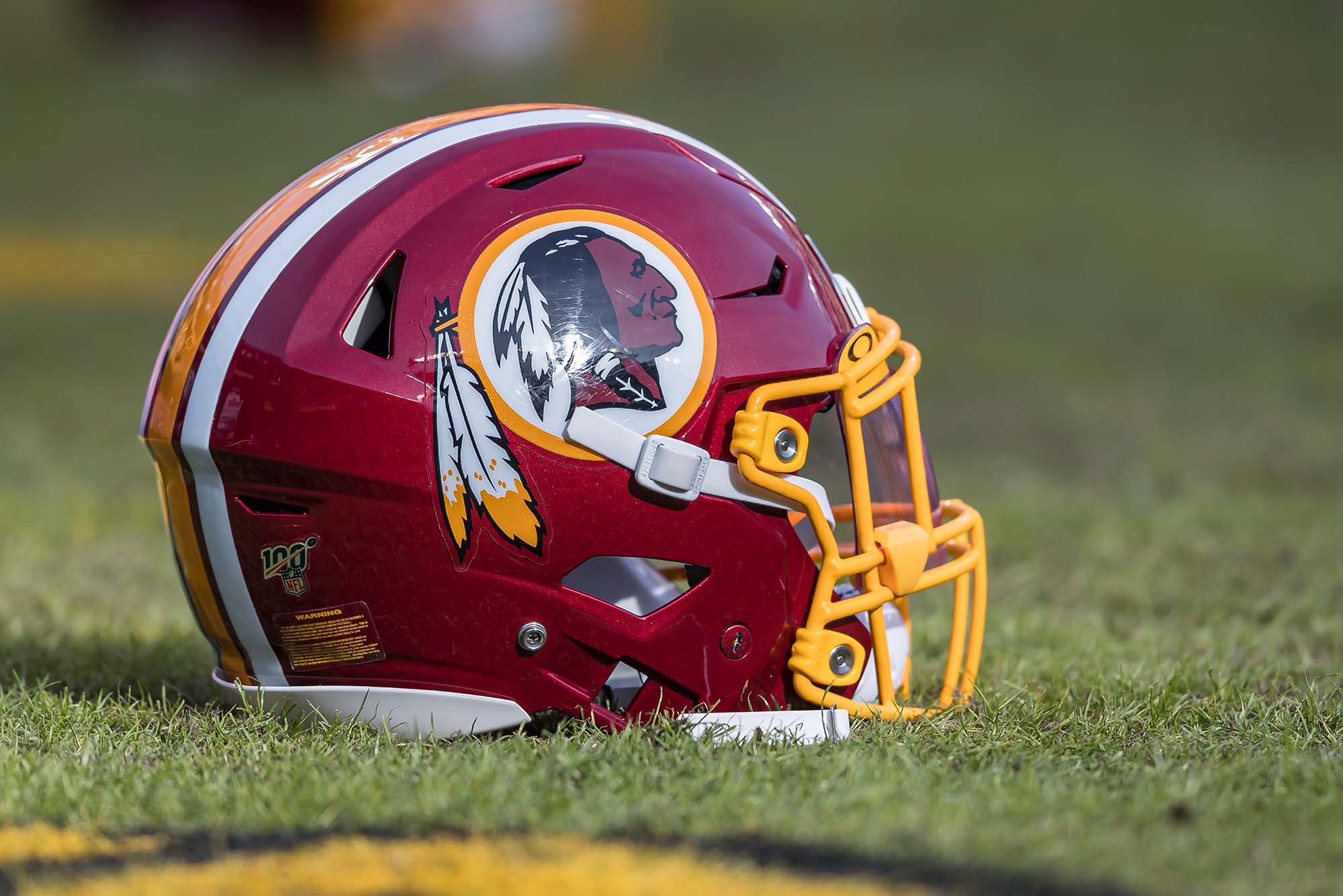 a photo of a Washington Redskins helmet featuring the old logo on the field before the game between the Washington Redskins and the New York Giants at FedExField