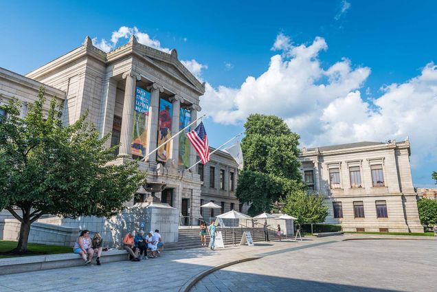 a photo of the entrance of the Museum of Fine Arts in Boston on a sunny day