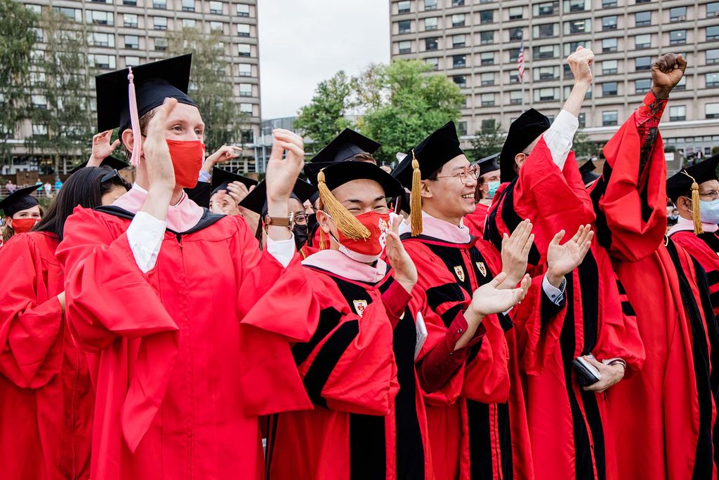 Class of 2020 students cheer during Boston University's 147th Commencement ceremony on Nickerson Field.